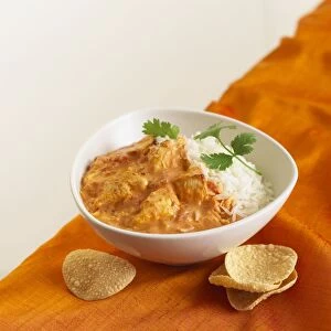 Chicken curry with basmati rice and coriander, served with mini poppadoms