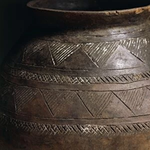 Cinerary urn decorated with engravings, Detail of geometric motif