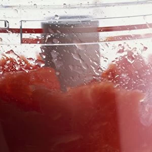 Close-up of tinned tomatoes in food processor