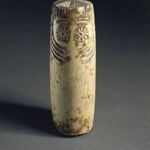 Cylindrical alabaster idol with face depicted, from megalithic tomb in Estremadura