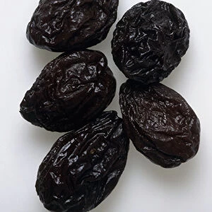 Five dried prunes, close-up