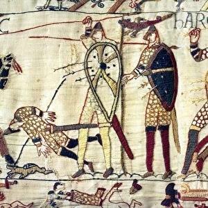 English King Harold lies dead at the Battle of Hastings during the Norman Invasion of 1066