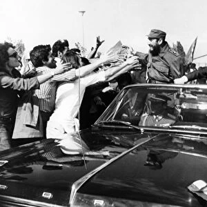 Fidel castro of cuba with president salvador allende being greeted by chilean students upon his arrival at pudahuel airport in santiago on november 10, 1971