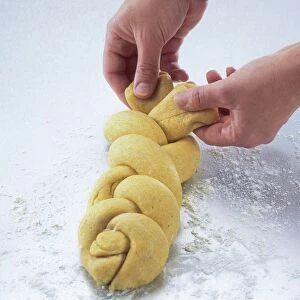 Folding over final section on a dough plait