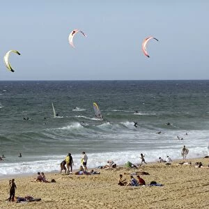 France, Gironde, Lacanau-Ocean, tourists on beach and Kiteboarding