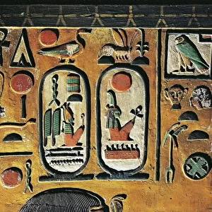 Goddess Hathor offers her necklace to the Pharaoh. Painted relief from a pillar of the tomb of Seth I at Thebes, detail, Seths cartouche