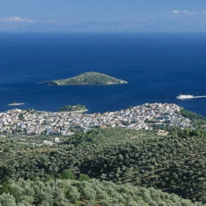 Greece, Skiathos, view of Skiathos town from the church of Profitis Ilias, sea and island beyond