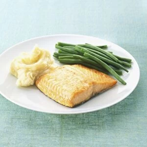 Grilled salmon fillet served with mashed potato and green beans
