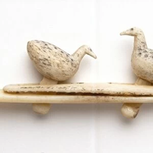Inuit carving of two birds feeding