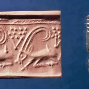 Limestone cylinder seal and clay impression with frieze of ibex and plants
