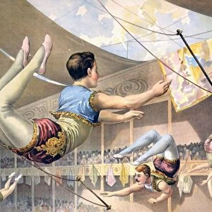 Five male trapeze artists performing at a circus c1890