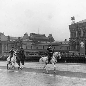 Marshal georgy zhukov accompanied by commander of the parade, marshal of the soviet union, k, rokossovsky riding across red square prior to the victory parade on june 24, 1945