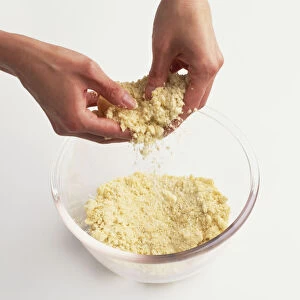 Mixing Butter and Flour Mixture with fingers to make Pastry