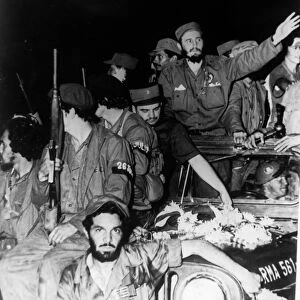 Newly victorious fidel castro ruz entering havana at the head of his revolutionary army, cuba, 1959, juan almeida bosque is behind him in profile