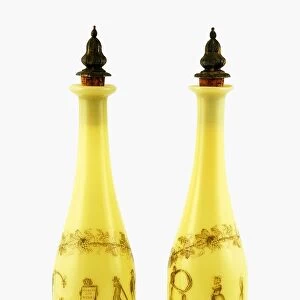 Pair of Richardsons yellow glass decanters, with silver gilt stoppers, decorated