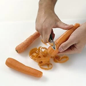 Peeling a carrot with a vegetable peeler