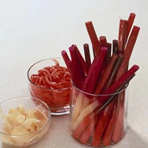 Pickled ginger in the form of shoots (hajikami shoga), strips (beni shoga), and sliced, close-up