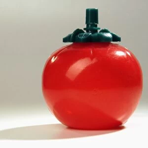 Plastic tomato-shaped ketchup dispenser