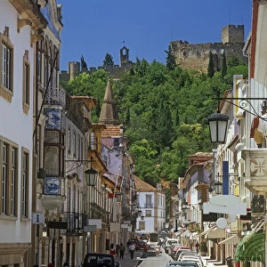 Portugal, Tomar, Rua Serpa Pinto, street overlooked by old castle