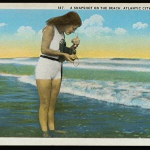 Postcard of a Woman Photographing the Ocean. ca. 1921, 147 A Snapshot on the Beach, Atlantic City, N. J. Published by Saltzburgs Merchandise Co. Atlantic City, N. J