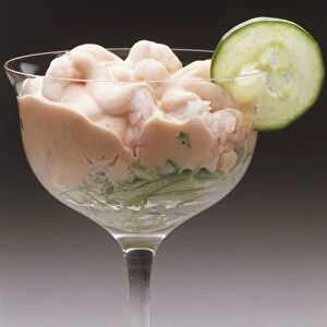 Prawn cocktail garnished with a slice of cucumber