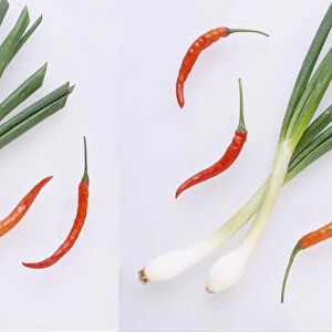 Red chilli peppers and spring onions, close-up