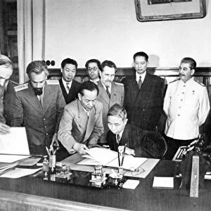 Signing of treaty of friendship and alliance between the soviet union and the chinese republic, mr, wang shi-tse signs the treaty, while stalin, molotov, lozovsky, dr, t, v, song, mr, foo ping-sheung, petrov, ussr ambassador to china, and others