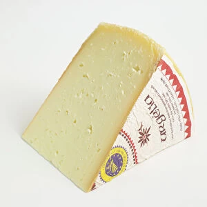 Slice of Spanish L Alt Urgell y La Cerdanya DOP cows milk cheese