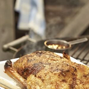 Smoke-roasted whole duck in roasting pan