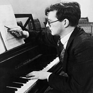 Soviet composer, dmitri shostakovich, working at his piano