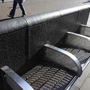 A sunlit bench in Cornmarket Street, Oxford