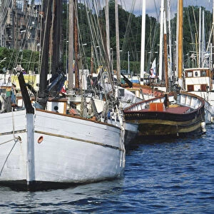 Sweden, Stockholm, front view of an old wood-carrying boat moored alongside the Strandvagen quay
