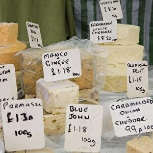 UK, Derbyshire, Bakewell, locally produced cheese on market stall