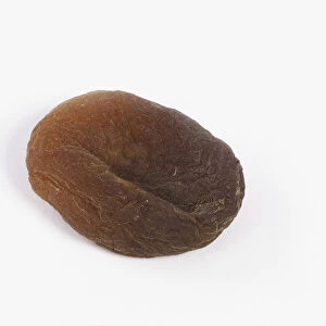Unsulphured dried apricot against white background