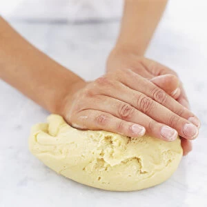 Using hands to knead dough, close up