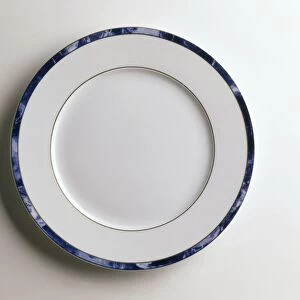 A white plate with blue rim