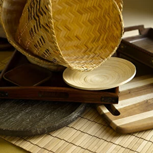 Wicker basket, serving dish, serving tray, plate and mat made from wood and bamboo