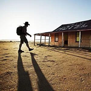 man in front of outback shed