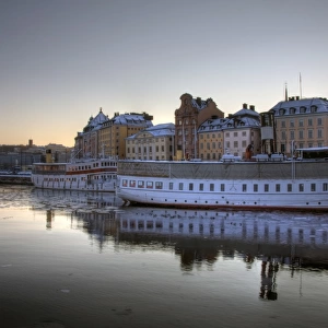 Stockholm Gamla Stan and boats at winter sunset