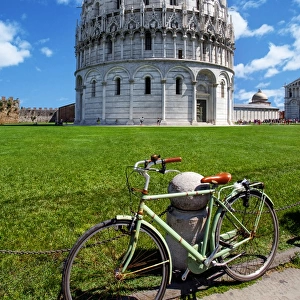 View of Pisa Baptistry With a Bicycle in the Foreground At Piazza dei Miracoli (Piazza del Duomo), Pisa, Tuscany, Italy