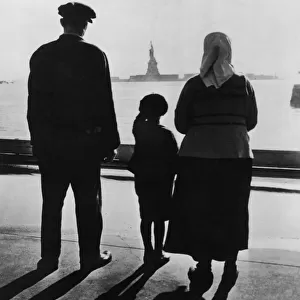 Family Views Statue Of Liberty From Ellis Island