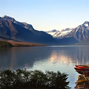 Lake McDonald and mountains, Boats at Glacier National Park, USA
