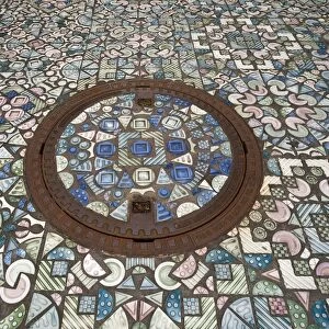 Manhole cover and walkway, paved with ceramic parts, Selb, Upper Franconia, Bavaria, Germany