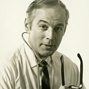 Physician wearing stethoscope, (B&W), (Portrait)