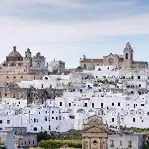 View of the town with the cathedral, right, and the church Chiesa delle Monacelle, left, Ostuni, Apulia, Italy