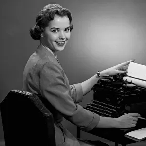 Woman working at typewriter