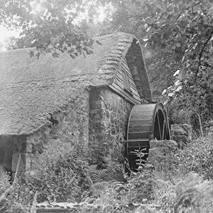Chagford Old Mill, Devon, showing the water wheel. June 1929