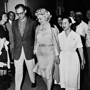 Marilyn Monroe and Arthur Miller leaving the Lennox Hill Hospital New York