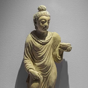 Buddha carrying the almones bowl. Afghanistan, Hadda site, 3rd and 4th. Stucco