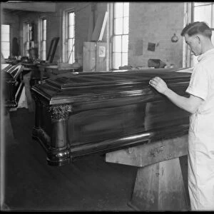 Inspecting a casket, Oneida, New York, April 3, 1916 (b / w photo)